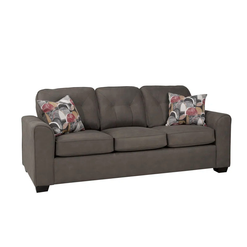 Mocha sofa with patterned cushions on a white background