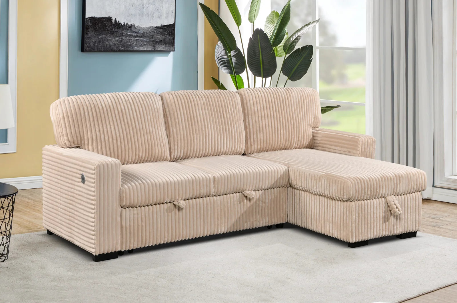 Beige sectional sofa in a living room setting with a window and plant in the background.