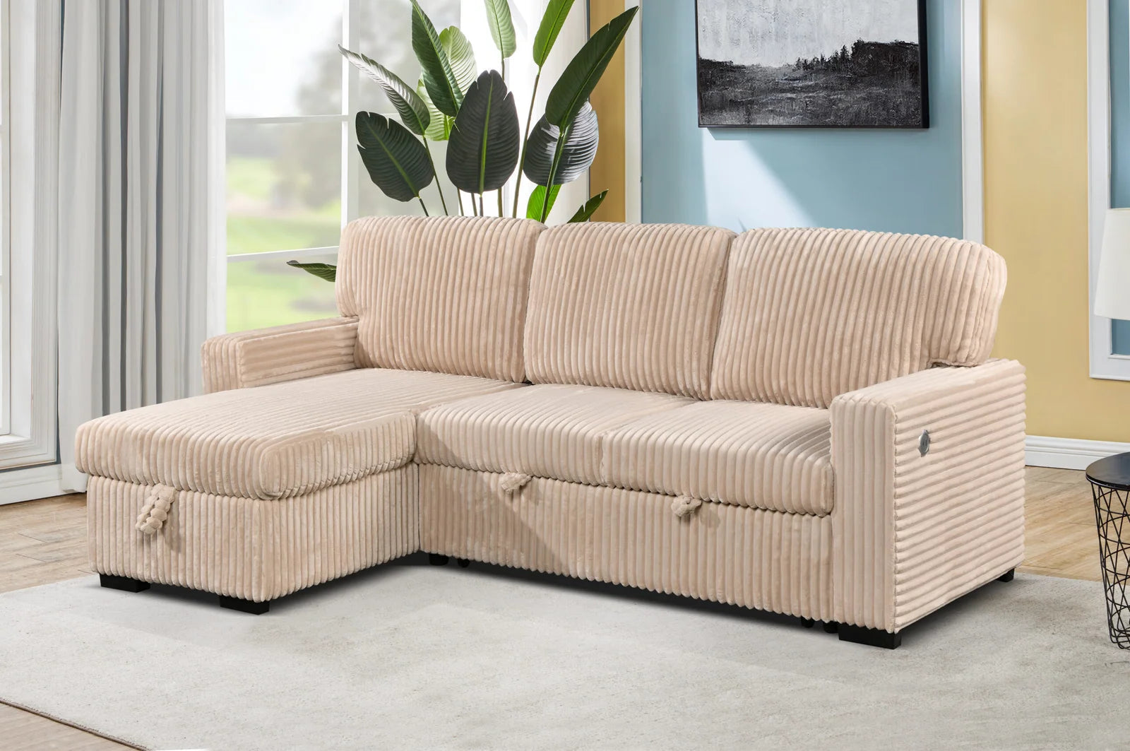 Beige sectional sofa in a living room setting with a window and plant in the background.