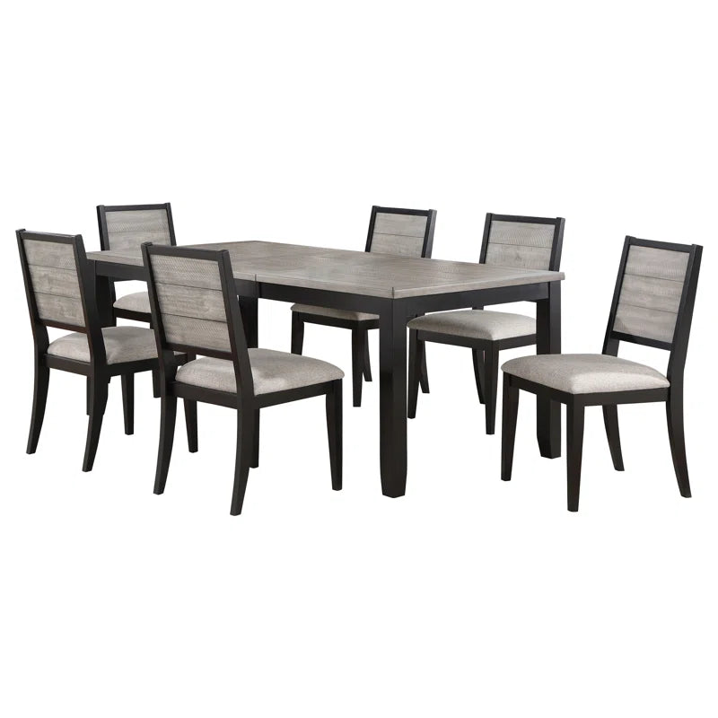 Dining table set with six chairs on a white background